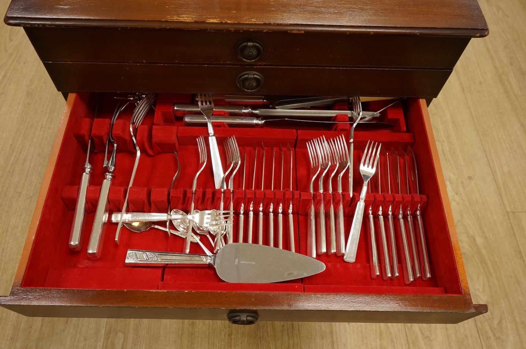 A mahogany canteen containing an Elkingtons suite of plated cutlery. 59cm wide x 42cm deep x 62cm high. Condition - table scratched cutlery good